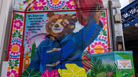 A vibrant mural of Paddington Bear outside Waterloo station