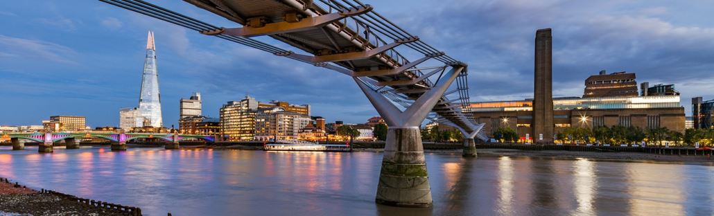 View of Millennium Bridge at sunset with Tate Modern in the background 