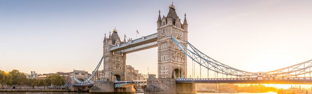 Tower Bridge with sun shining on River Thames