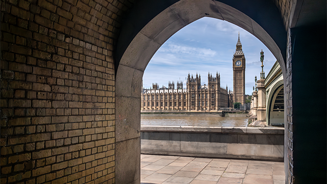 A view of Big Ben, the Houses of Parliament and the river Thames from an archway