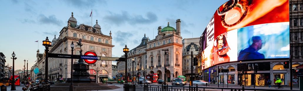 View over Piccadilly Circus, including its Tube sign and advertising screen.