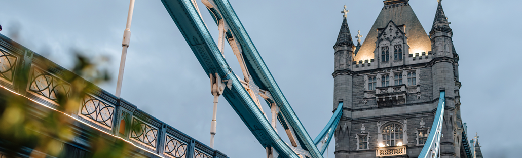 View of Tower Bridge from below with lights illuminating the architecture